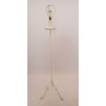 A painted wrought iron standard lamp with petal style sconce, 147cm tall