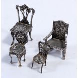 A group of four various miniature silver chairs, 34g, tallest 5.5cm