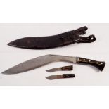 A horn handled Gurkha kukri knife with two smaller knives in leather sheath