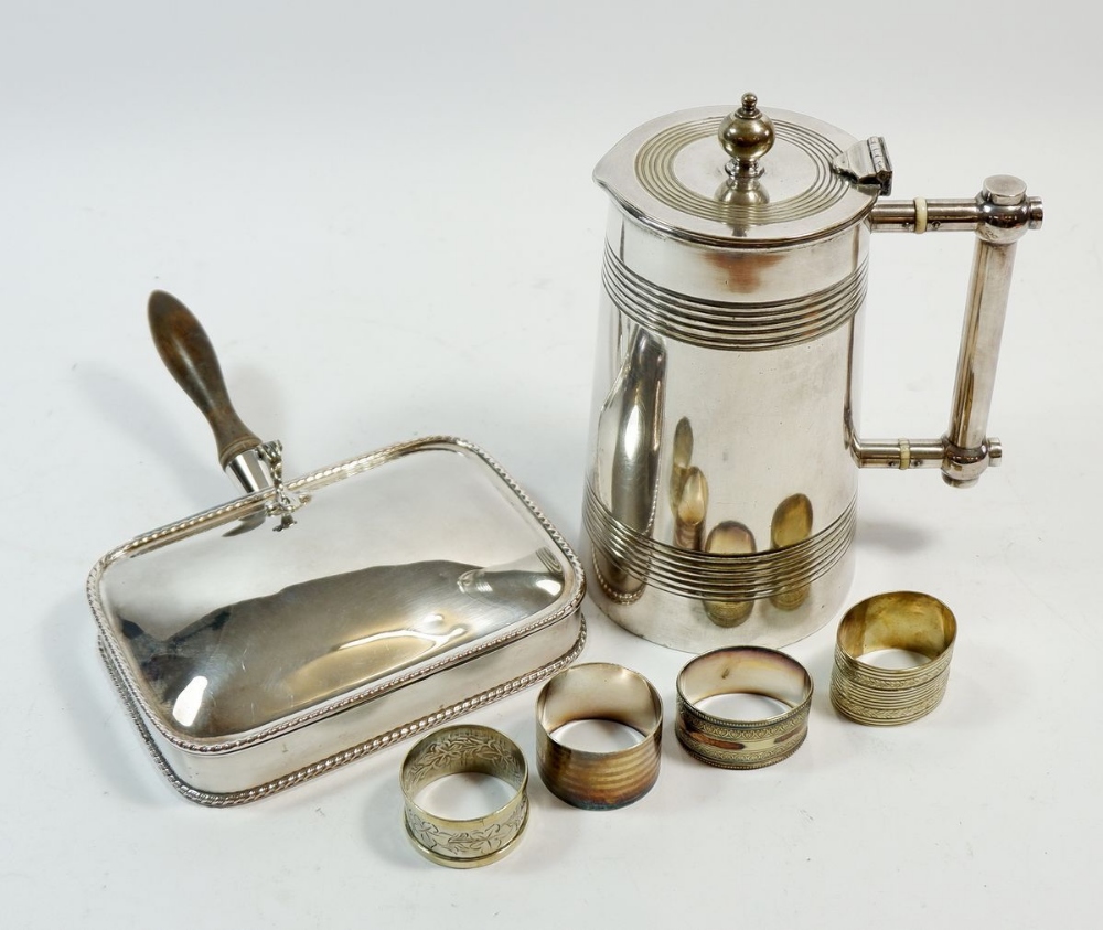 A Victorian silver plated jug, 20cm tall a cigarette box and four napkin rings (6)