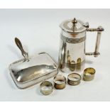 A Victorian silver plated jug, 20cm tall a cigarette box and four napkin rings (6)