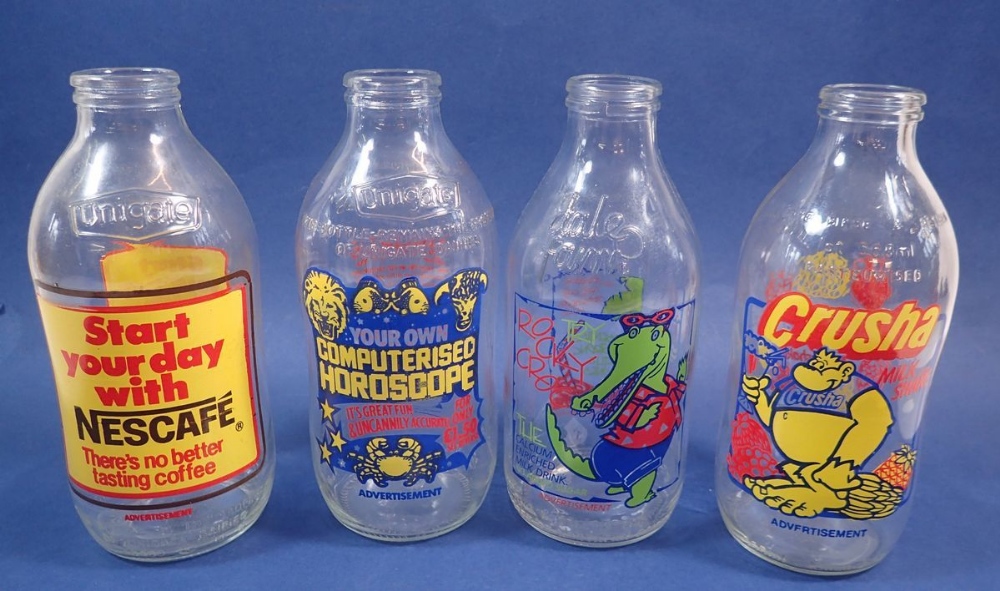 Four vintage advertising milk bottles, Nescafe, Crusha, Rocky Croc and Computerised Horoscope