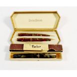 A Conway Stewart fountain pen and pencil boxed and boxed Parker pen also boxed