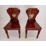A pair of 19th century fine quality shield back mahogany hall chairs in the style of Gillows painted