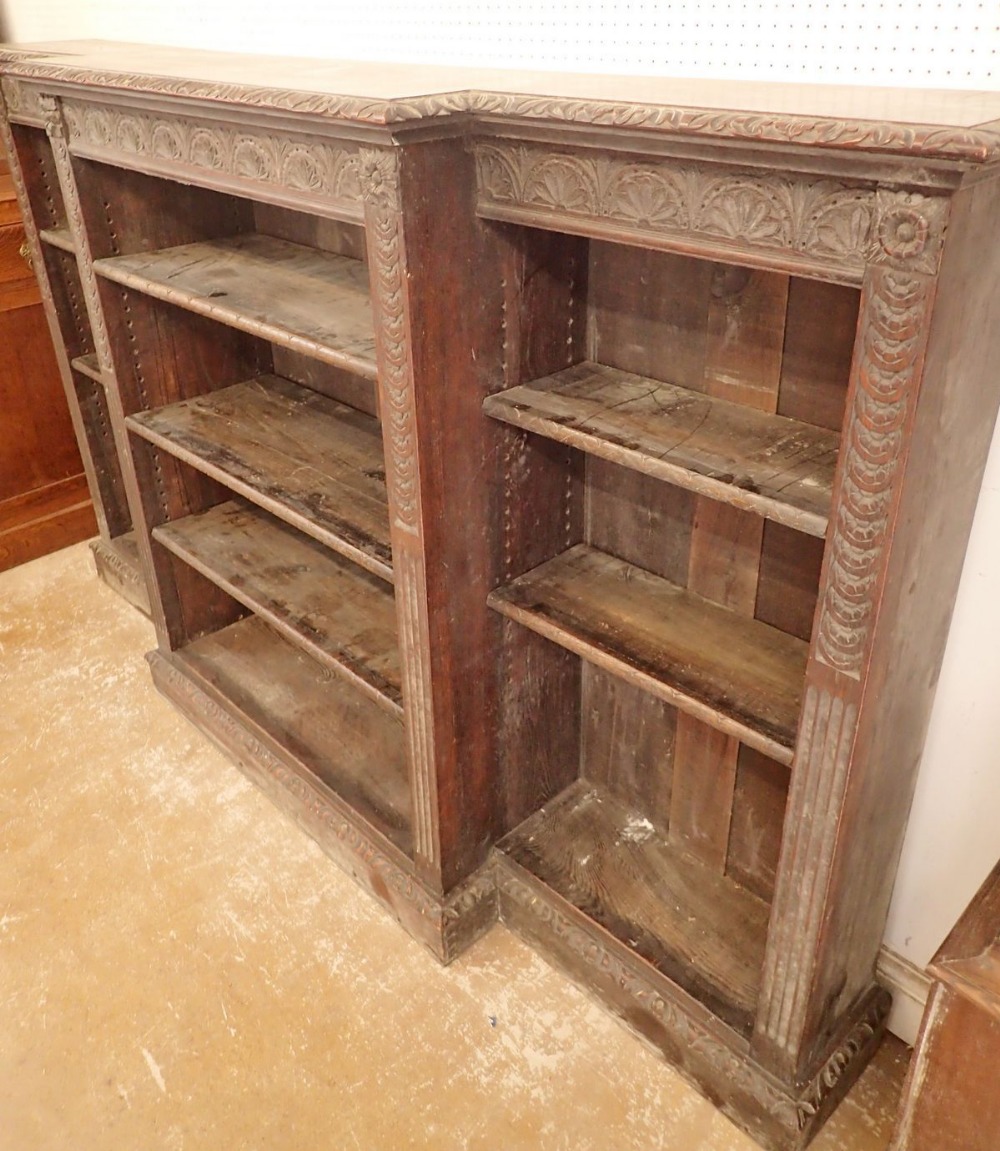 A 19th century dwarf oak breakfront bookcase with all over floral carved decoration and pilasters to - Image 2 of 4