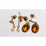 A pair of 9 carat gold earrings set oval cut citrines plus a 9 carat gold pair of pearl drop
