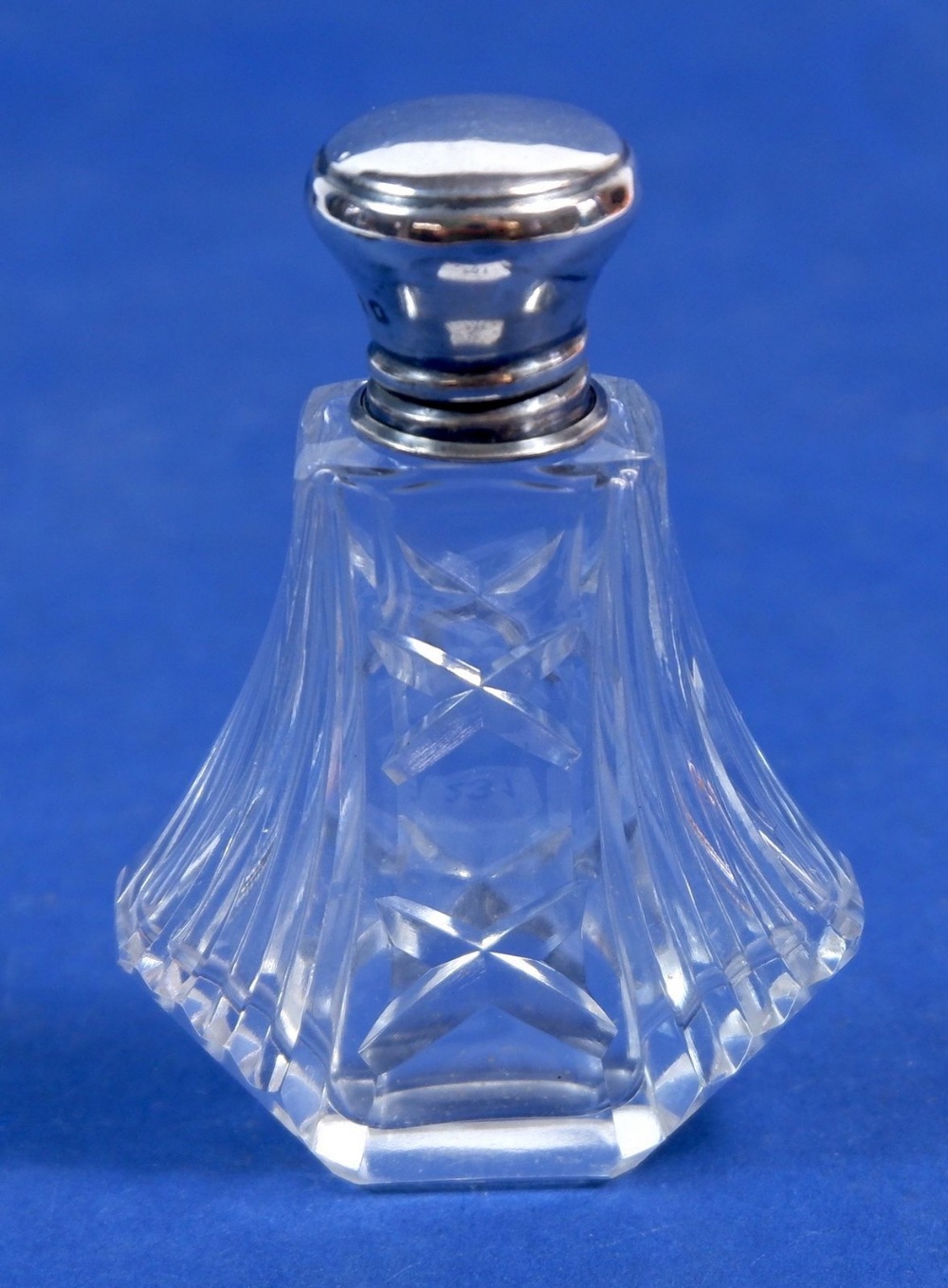 An Art Deco cut glass and silver topped scent bottle, London 1926