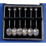 A sterling silver set of six bamboo style coffee spoons inset pearls to terminals, boxed