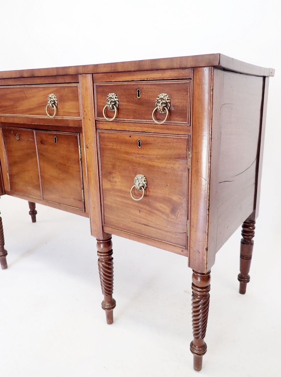 A Regency mahogany sideboard on turned supports with low back over three frieze drawers and four - Image 2 of 2