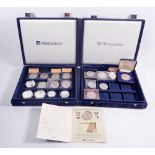 Two Westminster presentation coin cases with a quantity of coins and commemoratives to include: