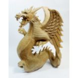 A large carved wooden dragon, 40cm