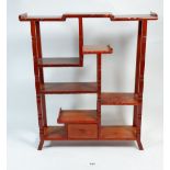 An oriental wooden miniature display shelf, 45 x 40cm