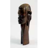 A tribal carved wooden bust, 36cm tall