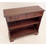 A reproduction mahogany console table with two short drawers over two shelves, 74cm tall x 77cm wide