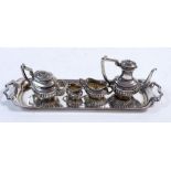 A miniature four piece silver tea and coffee service on tray, Birmingham 1969, 15cm long