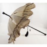 A Victorian silk parasol with ebonised handle