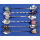 A set of six Brazilian white metal coffee spoons with stone set terminals