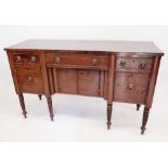 A Regency mahogany sideboard on turned supports with low back over three frieze drawers and four