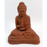 A red pottery seated goddess, 26cm