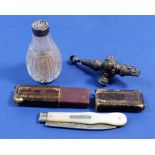 A Victorian silver whistle/rattle, a cut glass and silver mounted pepper pot and a silver and mother