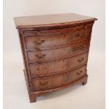 A reproduction mahogany bow fronted bachelors chest of four drawers with brushing slide, 80cm tall x