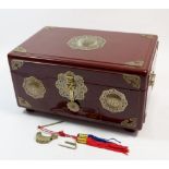 A Chinese lacquer jewellery box with brass mounts and lock, 33cm wide