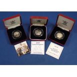 Three Royal Mint 50 pence silver proof commemorative issue in presentation cases and certificates