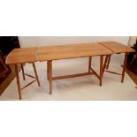 A mid century Ercol style light elm dining table with two freestanding extension leaves, 137 x 68cm,