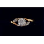 An Edwardian 18 carat gold cluster ring on openwork setting, size R, 2.7g