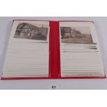 A red album of postcards including topo and miscellaneous (40)