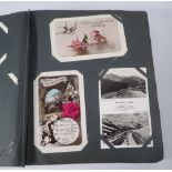 A postcard album of approx 120 including greetings, topos, transport etc