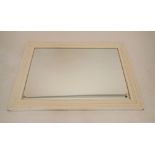 A large white painted bevelled mirror, 109 x 78cm
