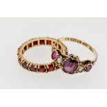 A Victorian 12 carat gold ring set amethysts and pearls a/f and a yellow metal garnet eternity