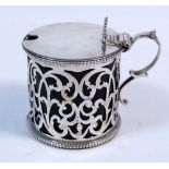 A pierced silver mustard pot with blue glass liner, London 1862 by Arthur Sibley, 102g silver weight