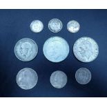 A quantity of silver content coinage including: George II 1757 sixpence, George III 1787 shilling,