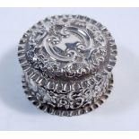 A silver circular trinket box with embossed decoration, Birmingham 1901