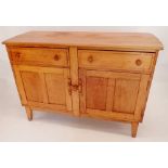 A mid century Ercol style sideboard with two drawers over two cupboards, 131 x 49.5cm