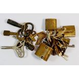 A collection of various padlocks with keys and clock and watch kegs