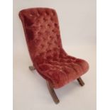 A Victorian slope back button upholstered chair