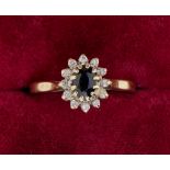A 9 carat gold sapphire and diamond cluster ring, size P-Q, 2.2g