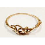 A Victorian 9ct gold knotted hinged bangle, 8.4g