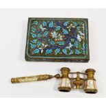 An enamel box decorated blue leaves and a mother of pearl pair of opera glasses