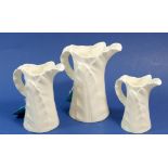 Three Royal Worcester white leaf graduated jugs, tallest 15cm