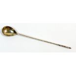A Norwegian silver spoon with long handle engraved to terminal, marked 830