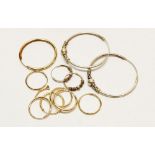 Three pairs of gold hoop earrings, 1.2g two yellow metal earrings 0.7g and two pairs of white