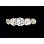An 18 carat gold and platinum set five stone diamond ring - 2.2cts of diamonds in total, Size M