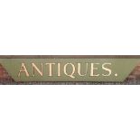 A large wooden hand painted 'Antiques' shop display sign for outside shop frontage, 235cm x 38.5cm