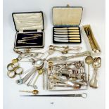 A box of silver plated cutlery and skewer etc.