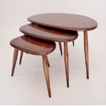An Ercol nest of three pebble tables, largest table 65cm wide