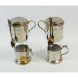 Two early 20th century coffee percolators consisting of a white metal press top, glass and white